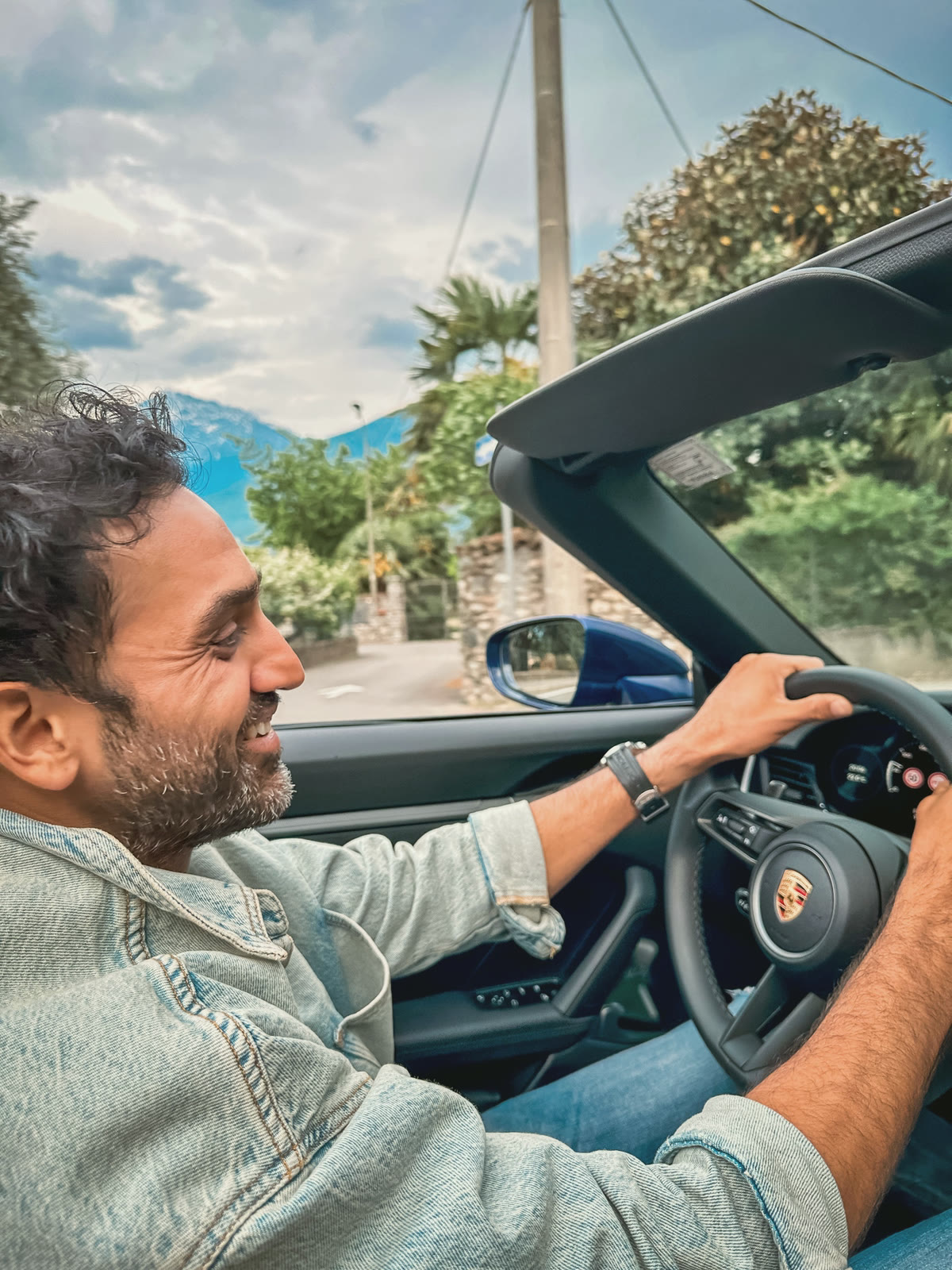 Devrath at the wheel of a Porsche 911